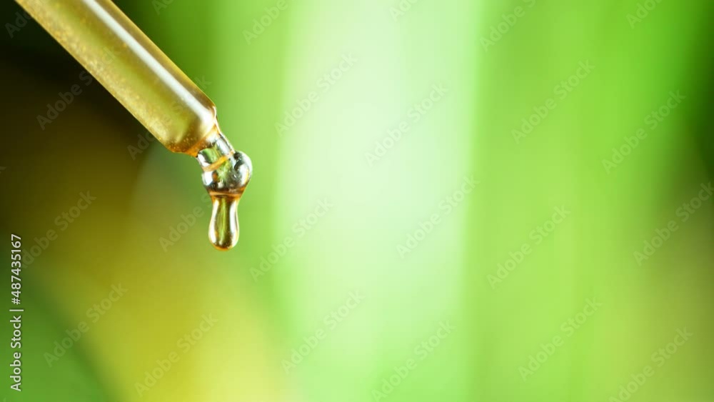 Dropper with Essential Oil Drops, Natural Therapy. Super Slow Motion at 1000 fps Dropper with Essential Oil Drops, Natural Therapy. Super Slow Motion at 1000 fps