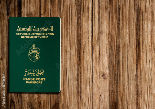 Tunisian passport on wooden background ,the Tunisian passport is issued to citizens of Tunisia for international travel.