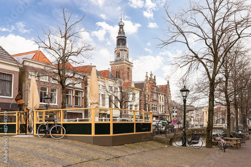 Cityscape of the center of Alkmaar with the tower of the weigh house in the background.