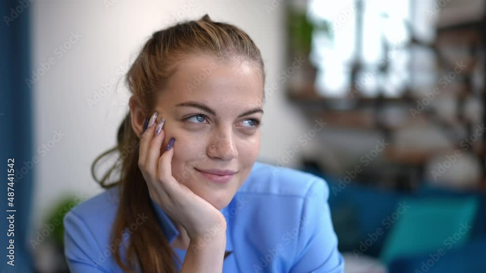 Portrait of smiling beautiful young brunette woman with grey eyes looking at camera and looking away dreaming. Elegant charming Caucasian slim lady in formal suit posing indoors at home Portrait of smiling beautiful young brunette woman with grey eyes looking at camera and looking away dreaming. Elegant charming Caucasian slim lady in formal suit posing indoors at home