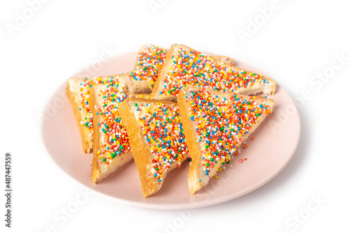 Traditional Australian fairy bread on plate isolated on white background