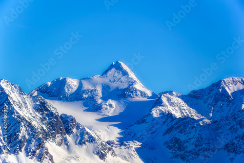 Austrian Alps covered with snow during sunny winter day.