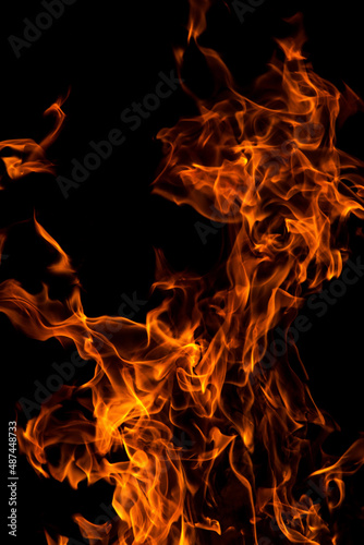 Orange red Fire flame against black background, abstract texture