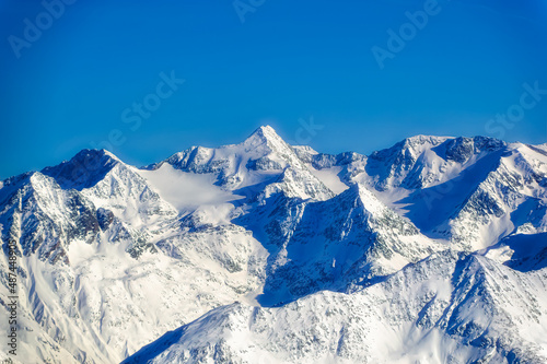 Austrian Alps covered with snow during sunny winter day. © Goran