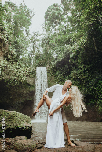 photo session of a couple in love, wedding photo session, young couple, photo of a couple at the waterfall, couple near the waterfall