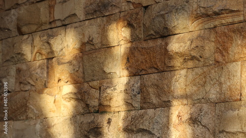 Natural stone wall exposed to sunlight