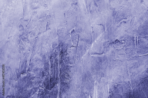 Very peri - the color of 2022. The texture of the concrete wall in purple and lilac tones. Background texture of cement wall on classic trendy color of the year 2022