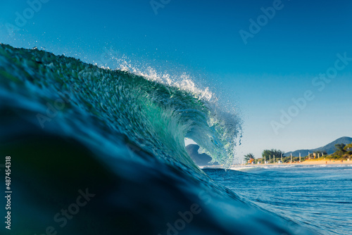 Fotografering Transparent wave in Atlantic ocean. Beach break wave in Brazil
