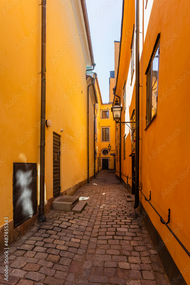 Fototapeta premium Narrow streets in historic part of town. Old fashioned buildings in Gamla stan. Stockholm, Sweden.