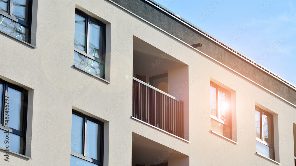 Abstract architecture, fragment of modern urban geometry,. Modern apartment building on a sunny day with a blue sky,. European residential apartment buildings.