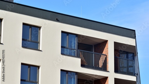 Abstract architecture, fragment of modern urban geometry,. Modern apartment building on a sunny day with a blue sky,. European residential apartment buildings. © Grand Warszawski