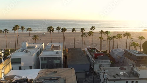 Venice Beach, California USA. Aerial View of Waterfront Buildings, Sandy Coast and Sunset Sun on Skyline, Drone Shot photo