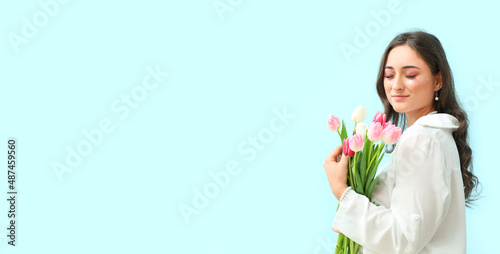 Happy young woman with crea...