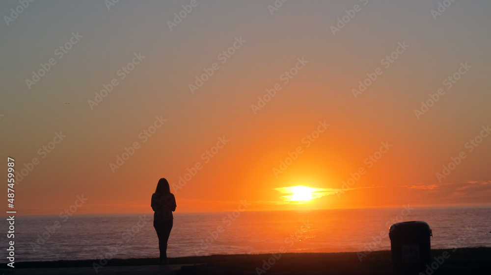 silhouette of a person on a sunset