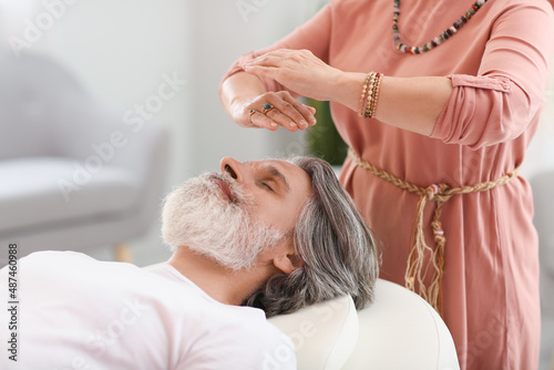 Reiki master working with p...
