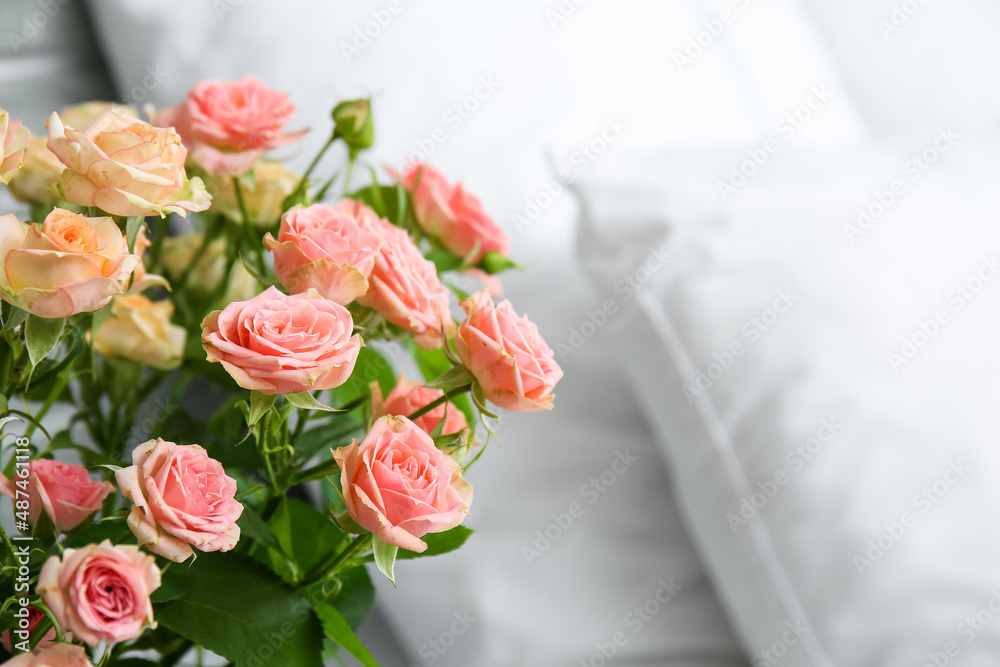 Fototapeta premium Bouquet of beautiful fresh roses in bedroom, closeup