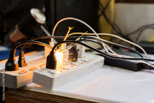 Obraz na plátně electric plug sparks Caused by short circuit The concept of danger, the use of n