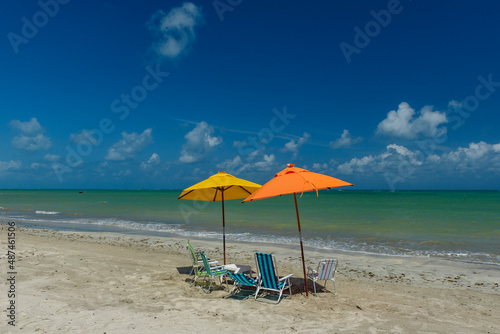 Fototapeta Naklejka Na Ścianę i Meble -  Beach. Sao Miguel dos Milagres, Alagoas, Brazil. Colorful umbrellas and chairs at Toque Beach on February 11, 2022.