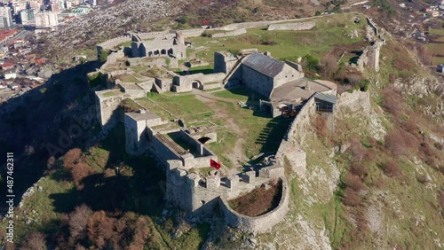 Rozafa or Shkoder castle is a hilltop archaeological park near Shkodra in Albania. Ancient fortress on top of a hill near the city of Skadar. Stone walls of medieval fortification - aerial drone view.