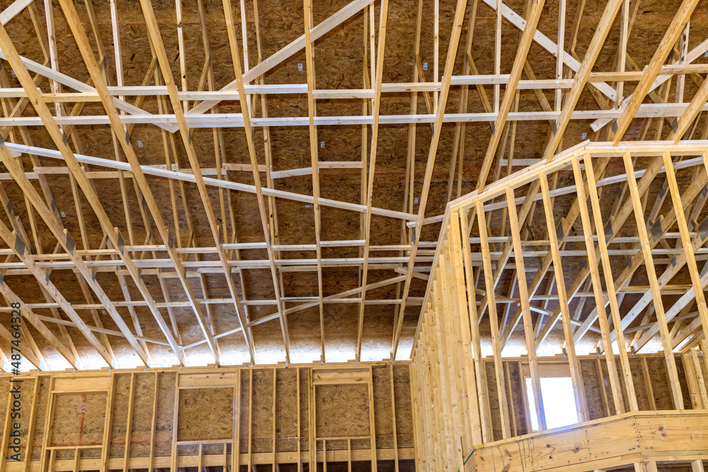 Wooden roof construction with rafters roof beams close-up