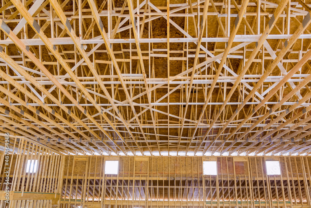 Installation of wooden with roof beams frame trusses condominium construction Installation of wooden with roof beams frame trusses condominium construction