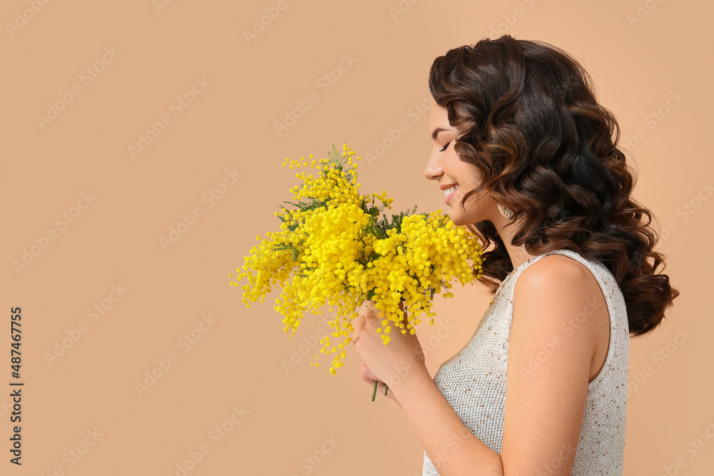Beautiful young woman with mimosa flowers on color background - obrazy, fototapety, plakaty 