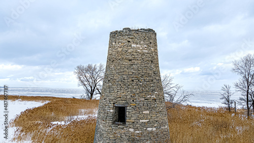 An abanoned ruined lighthouse in winter