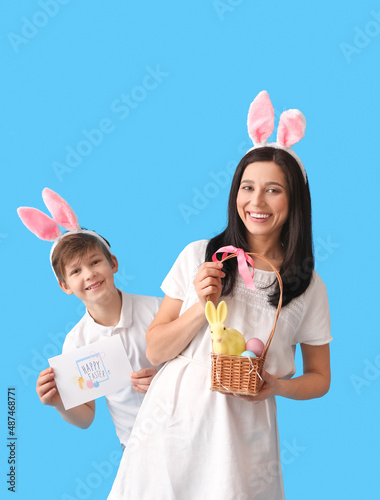 Little boy, his mother with...