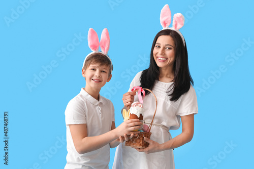 Little boy, his mother with...