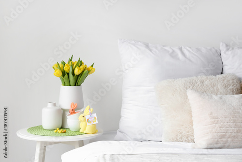 Vase with tulips, cups and ...
