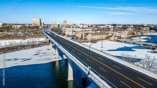 Snow covers landscape into the city photo