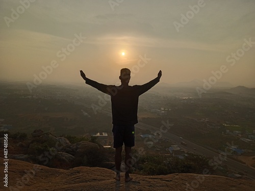 silhouette of man standing on top of mountain © Dream collection