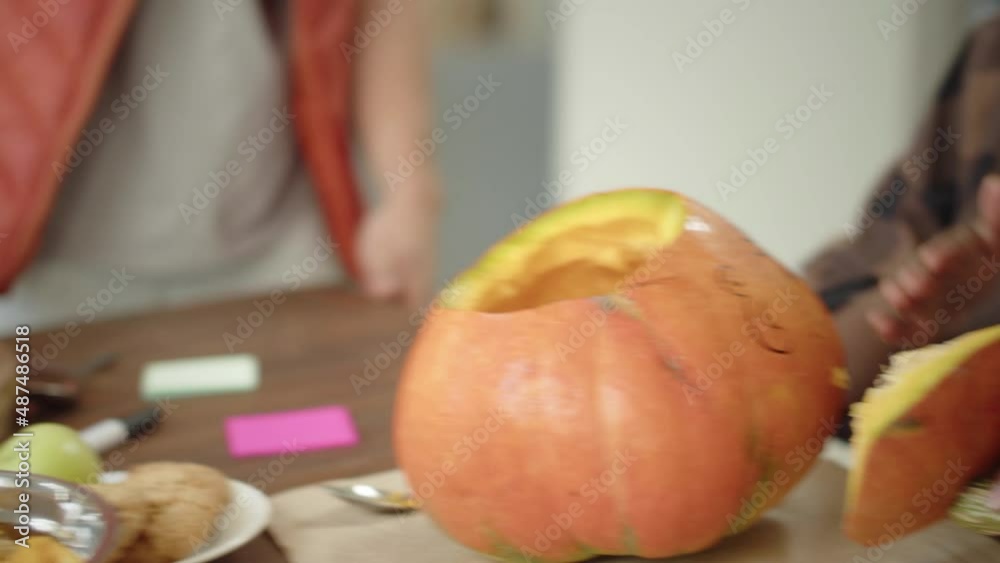 Beautiful girls are carving pumpkins together Beautiful girls are carving pumpkins together