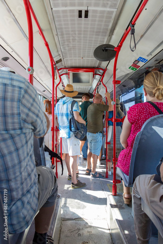 People ride a passenger bus in Rome