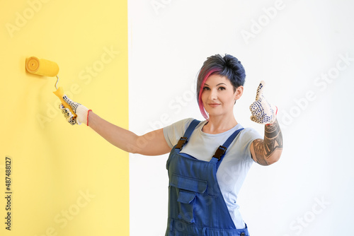 Female decorator painting y...