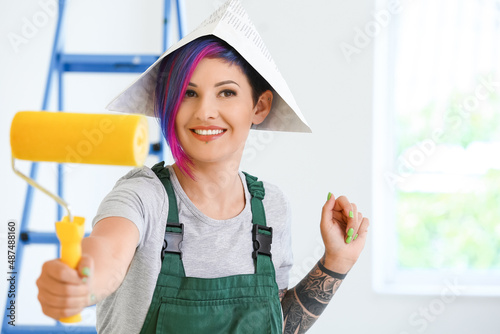 Female painter with paper h...