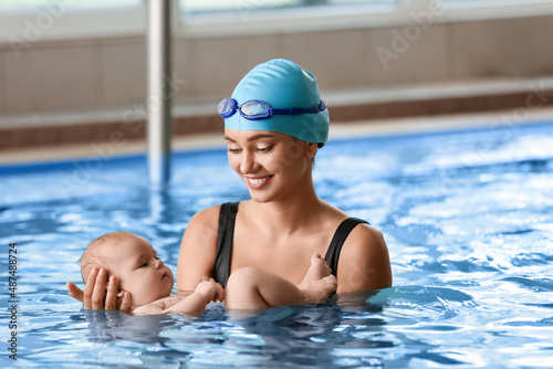 Female coach and adorable baby in swimming pool © Pixel-Shot