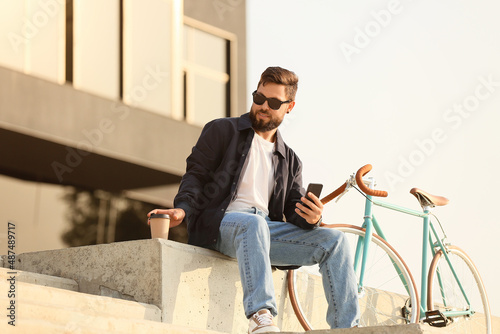 Stylish bearded man with mo...