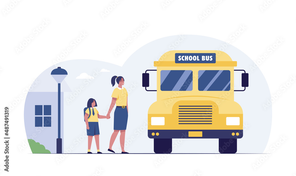 Back to school. Little girl with teacher waiting for bus at bus stop.
