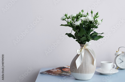 Vase with bouquet of beauti...