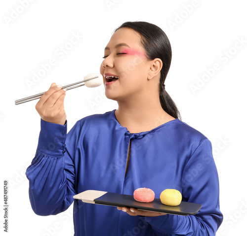 Beautiful Asian woman eatin...