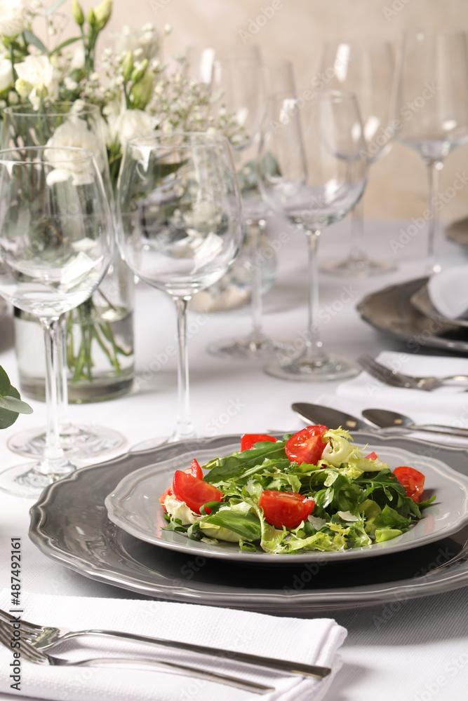 Delicious salad served on table in restaurant Delicious salad served on table in restaurant