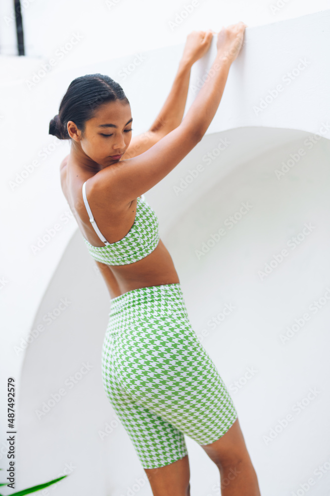 Obraz premium Girl in sportswear at home.