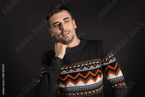 Handsome young man in knitt...