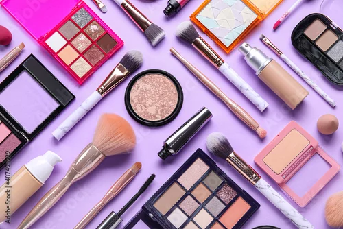 Obraz Beautiful makeup brushes with decorative cosmetics on lilac background