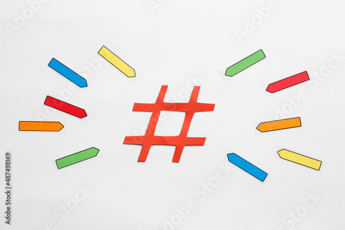 Flat lay composition with hashtag symbol on white background