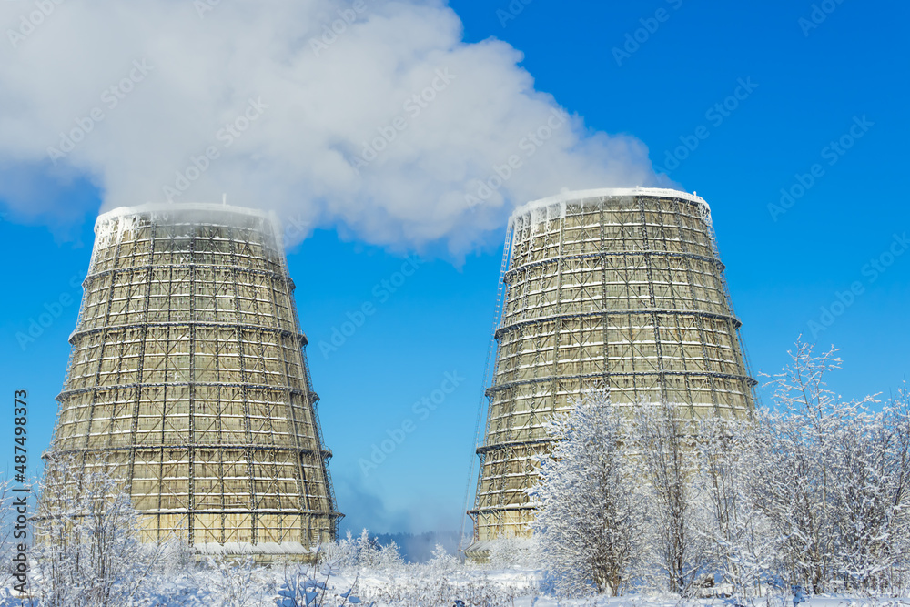 Two cooling towers work for the city .