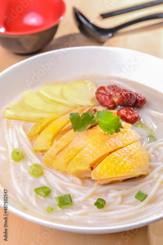 A Bowl Of The Rice Noodles and Sliced Chicken in Fish Soup