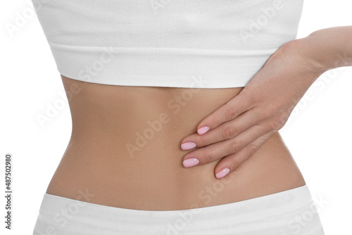 Woman suffering from pain in back on white background, closeup © New Africa
