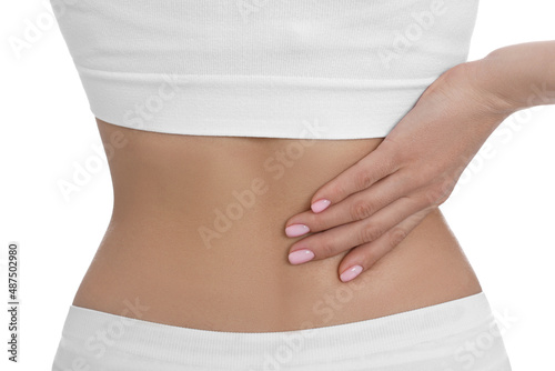 Woman suffering from pain in back on white background, closeup